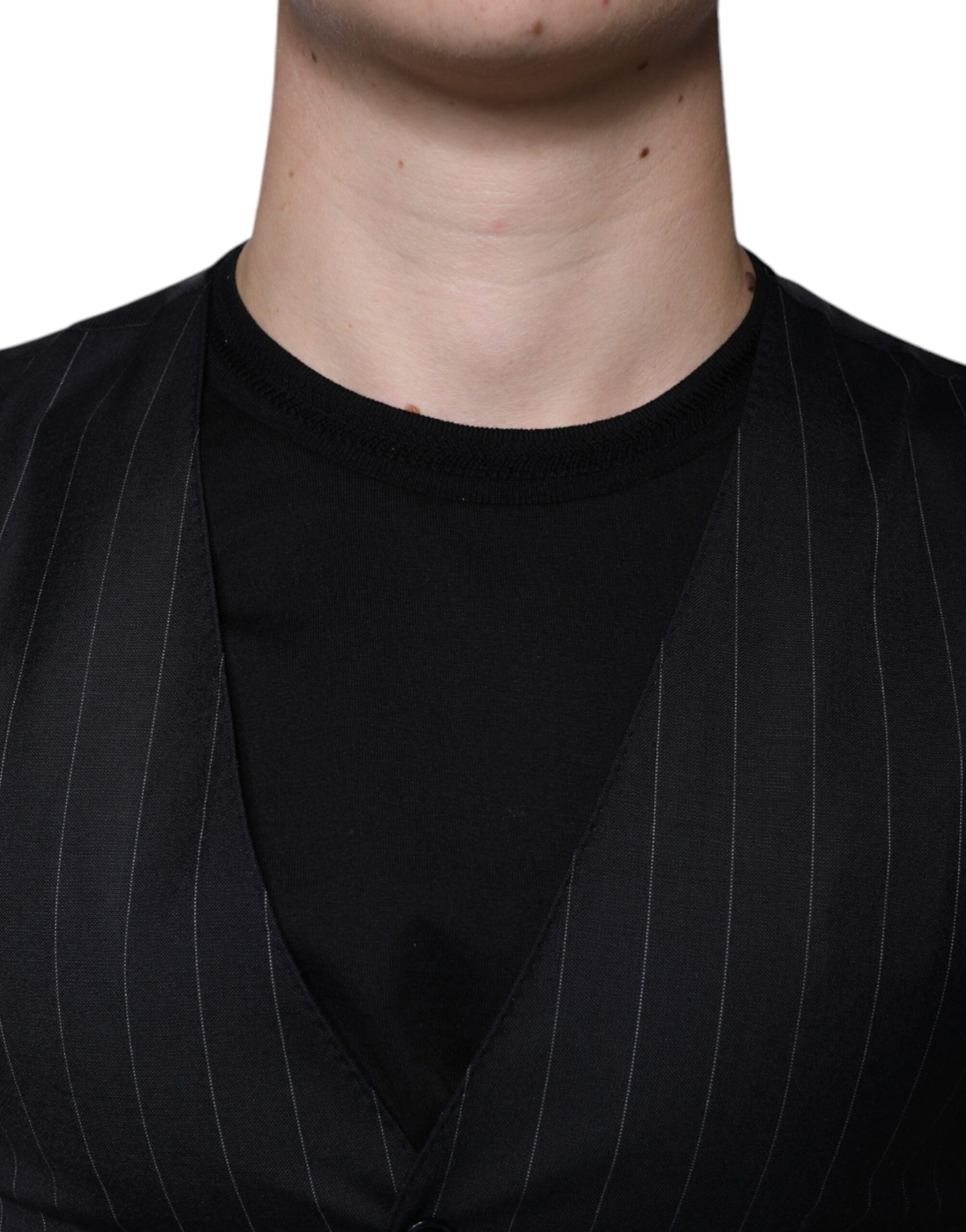 A black leather waistcoat with a lapel and button closure