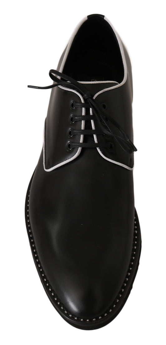 Black dress shoe with laces and a small heel
