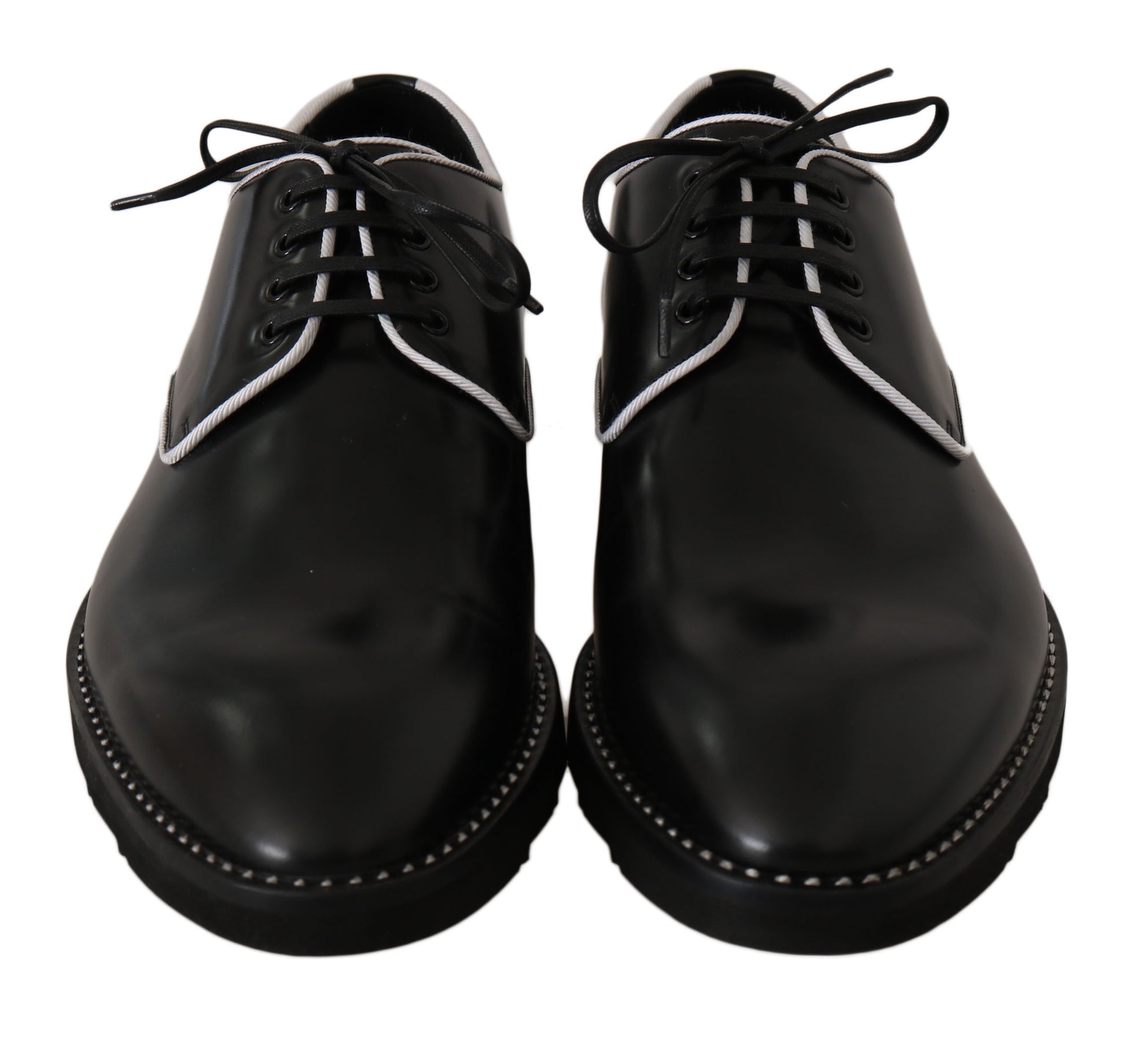 Pair of black dress shoes with white laces and stitching details