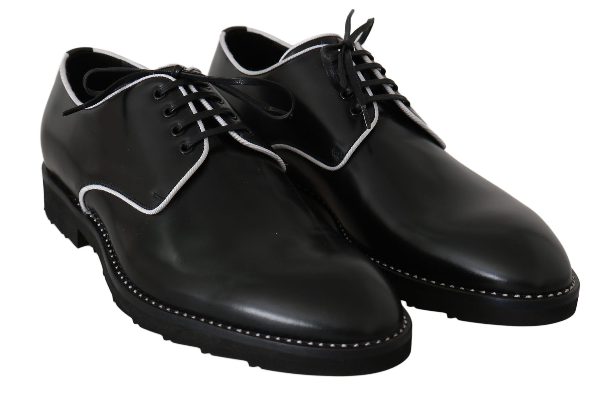 Pair of black dress shoes with laces and a small bow on each shoe