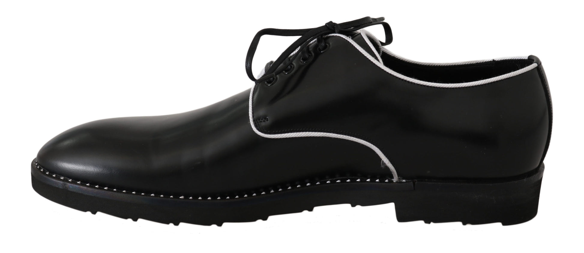 Black dress shoes with white laces and a strap across the top of each shoe