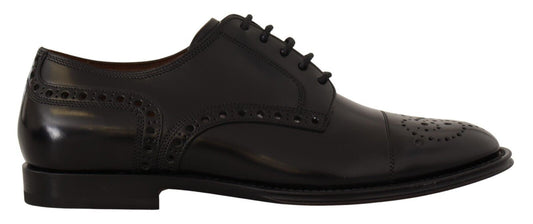 Pair of black dress shoes with laces and a small heel