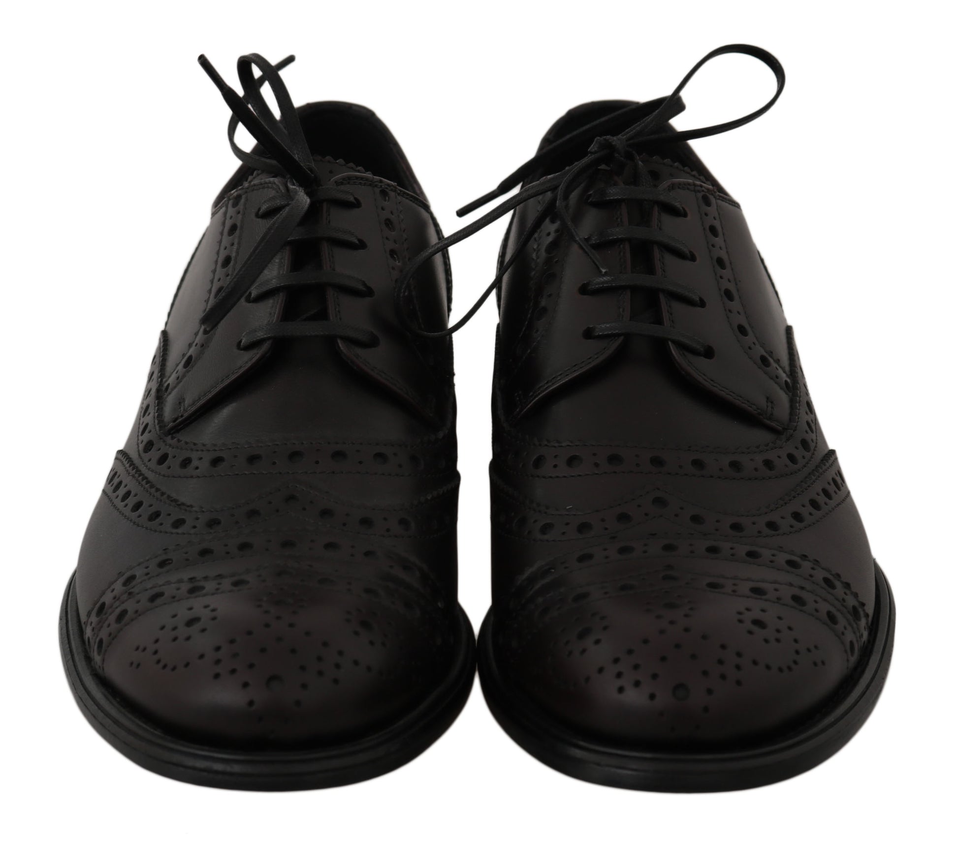 Pair of black lace-up dress shoes with perforated details and a low heel