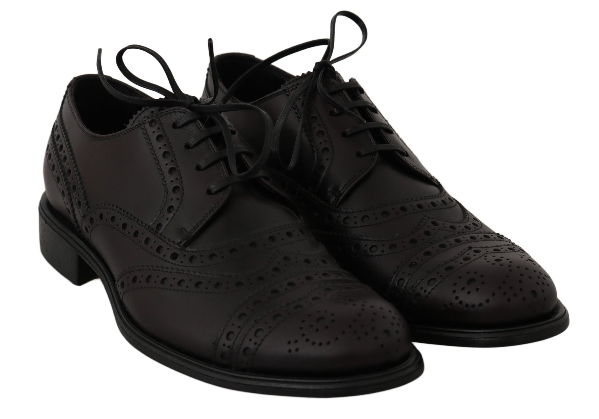 Pair of black leather shoes with laces and perforated design