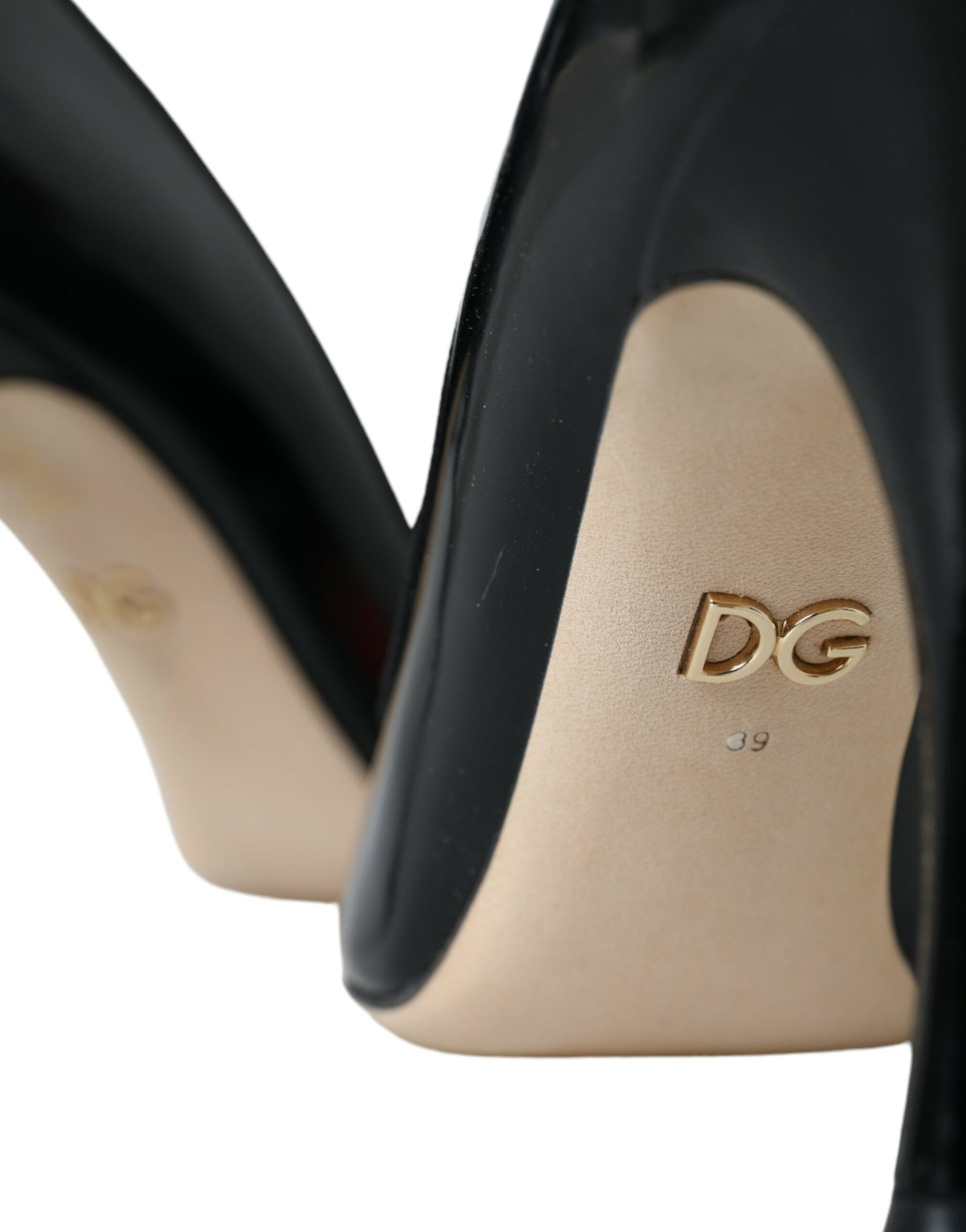 High heel shoe with gold lettering on sole