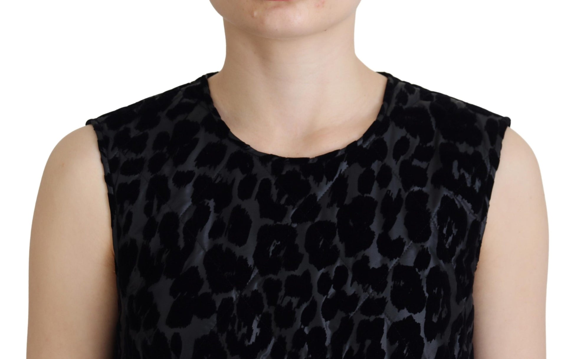 A black leopard print mini dress with a round neckline and short sleeves