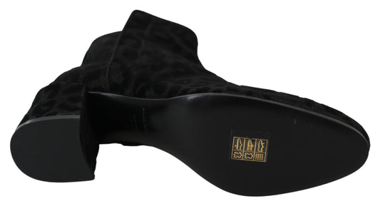 Pair of black velvet boots with gold buckle detailing