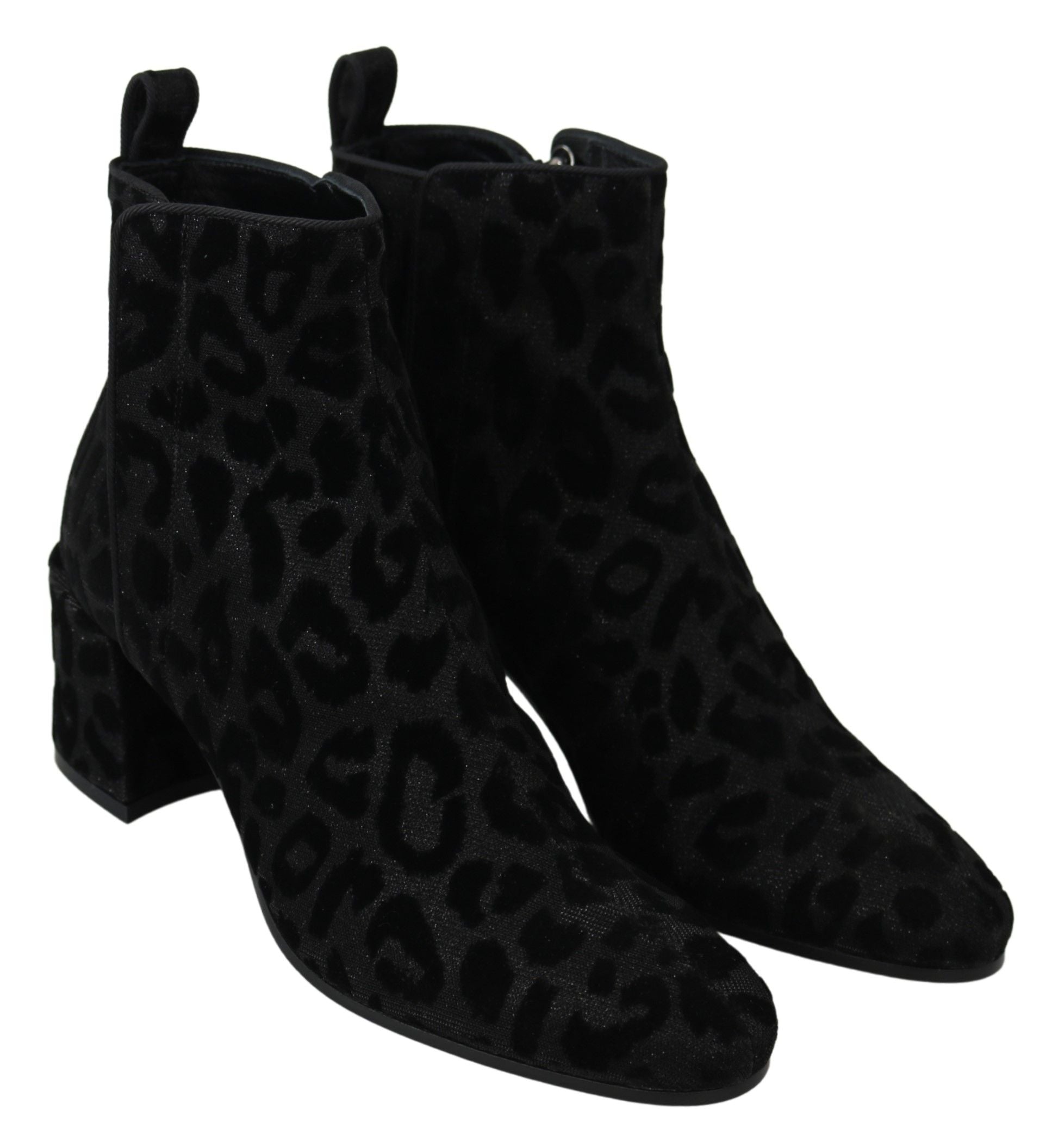 Pair of black suede boots with animal print pattern