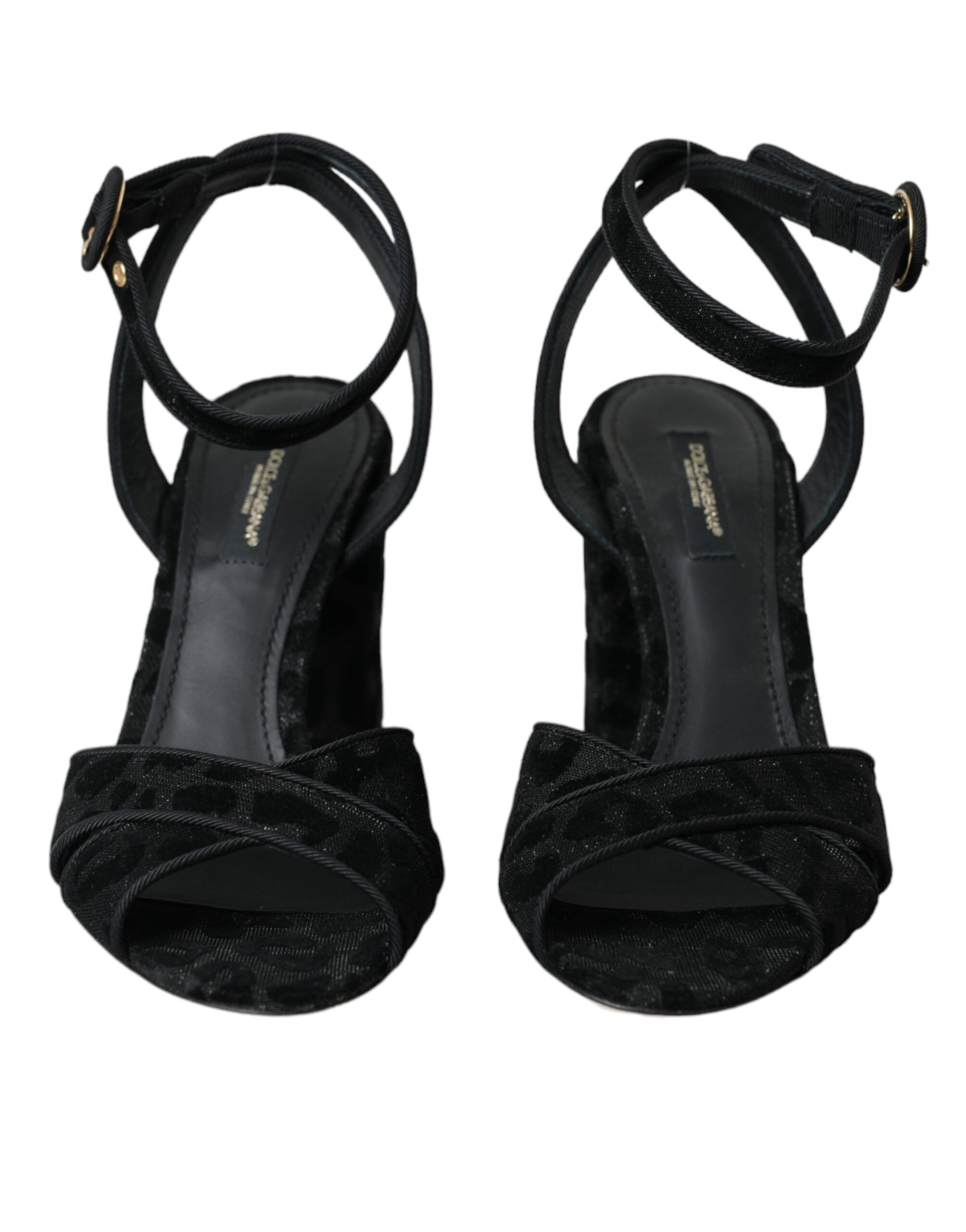 Pair of black high heel shoes with ruffled straps