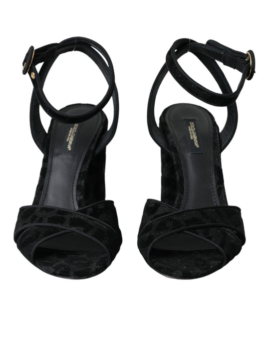 Pair of black high heel shoes with ruffled straps
