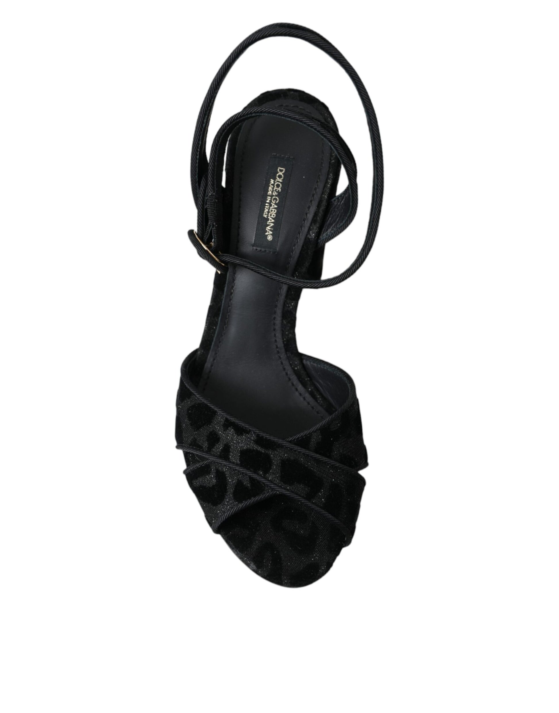 Black high heel shoe with embellishments on toe