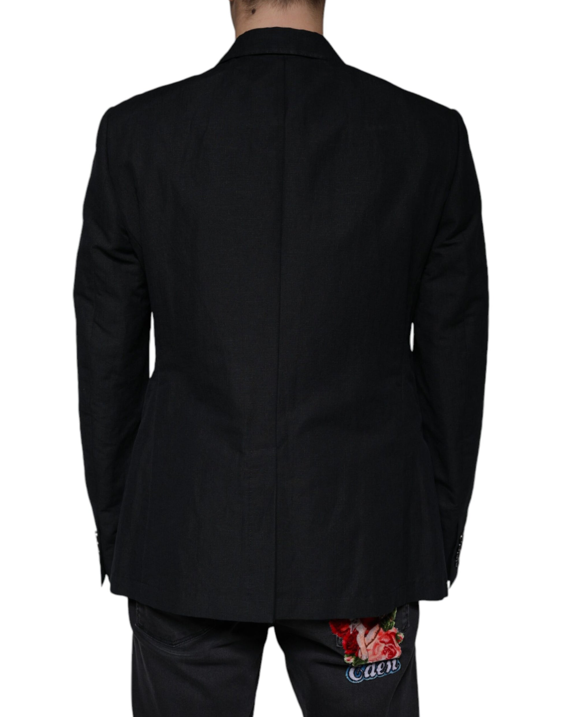 A black linen double breasted blazer with a floral print on the back
