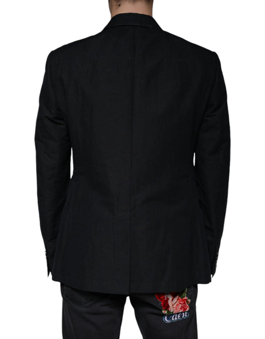 A black linen double breasted blazer with a floral print on the back