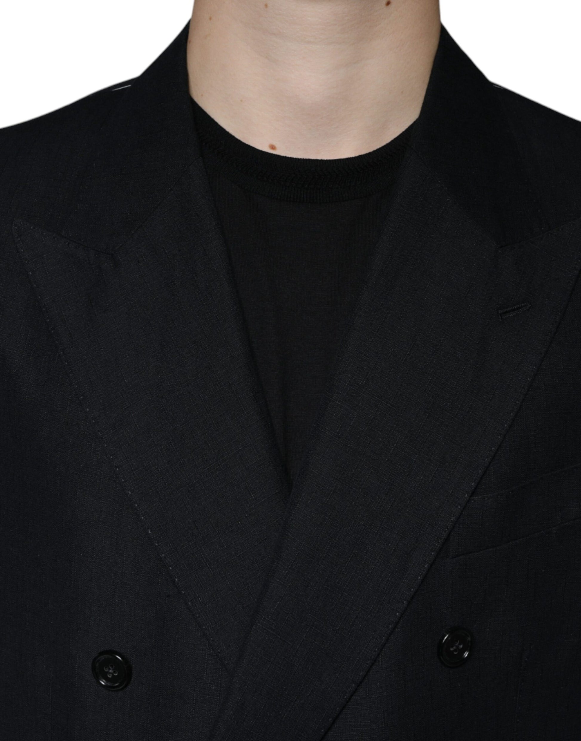 A black double-breasted blazer with a linen texture, featuring two visible buttons on the front