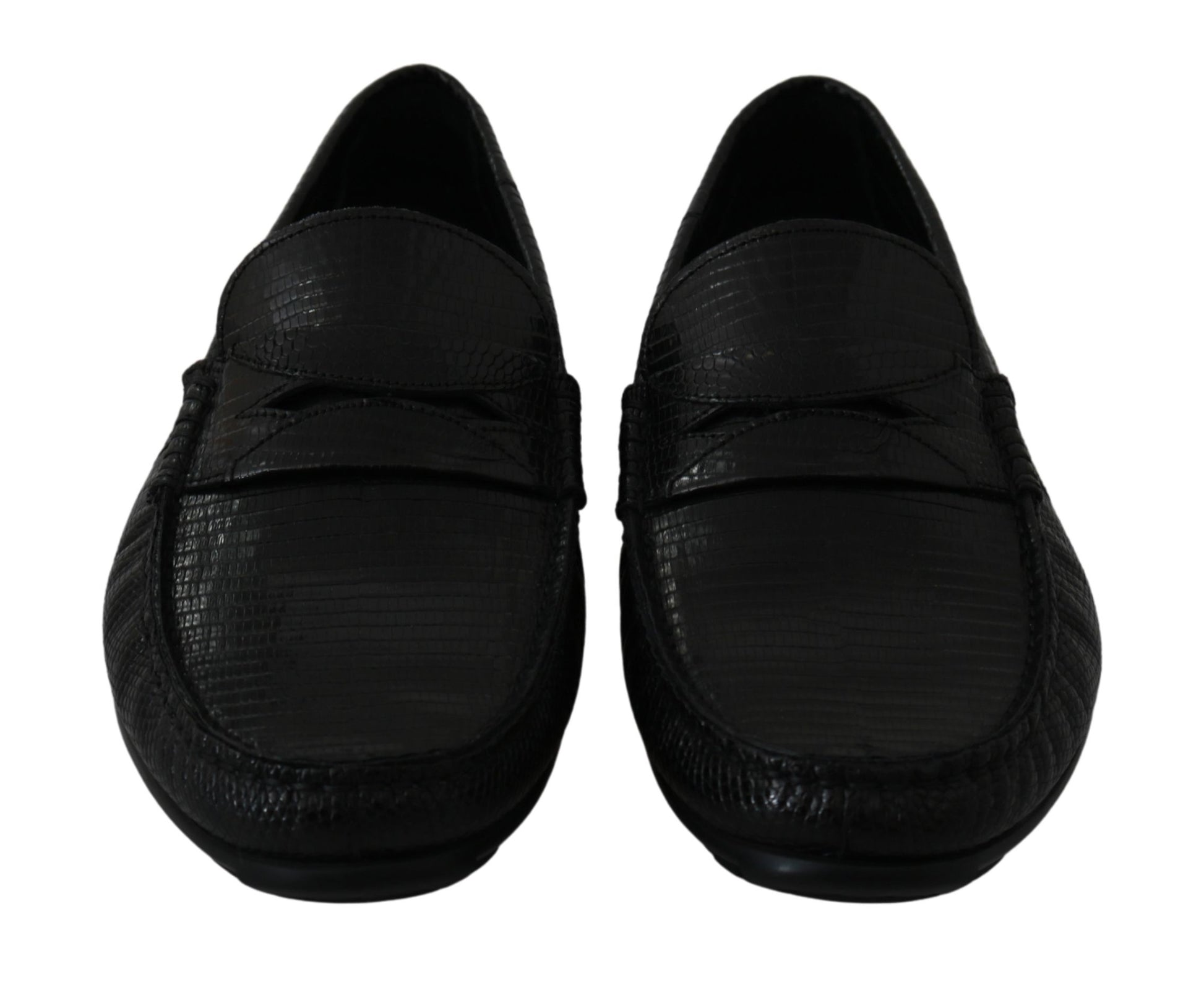 Pair of black shoes with a textured surface and laces