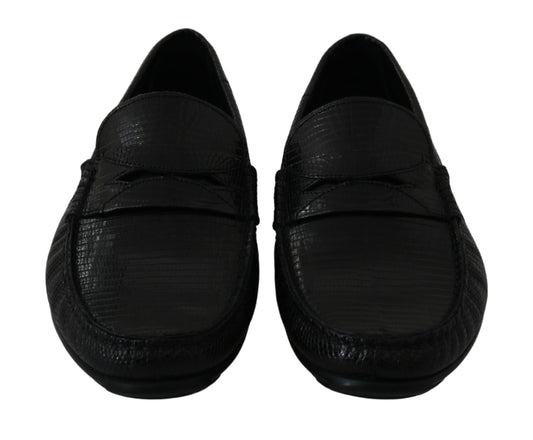 Pair of black shoes with a textured surface and laces