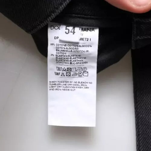 White tag on black jeans with washing instructions