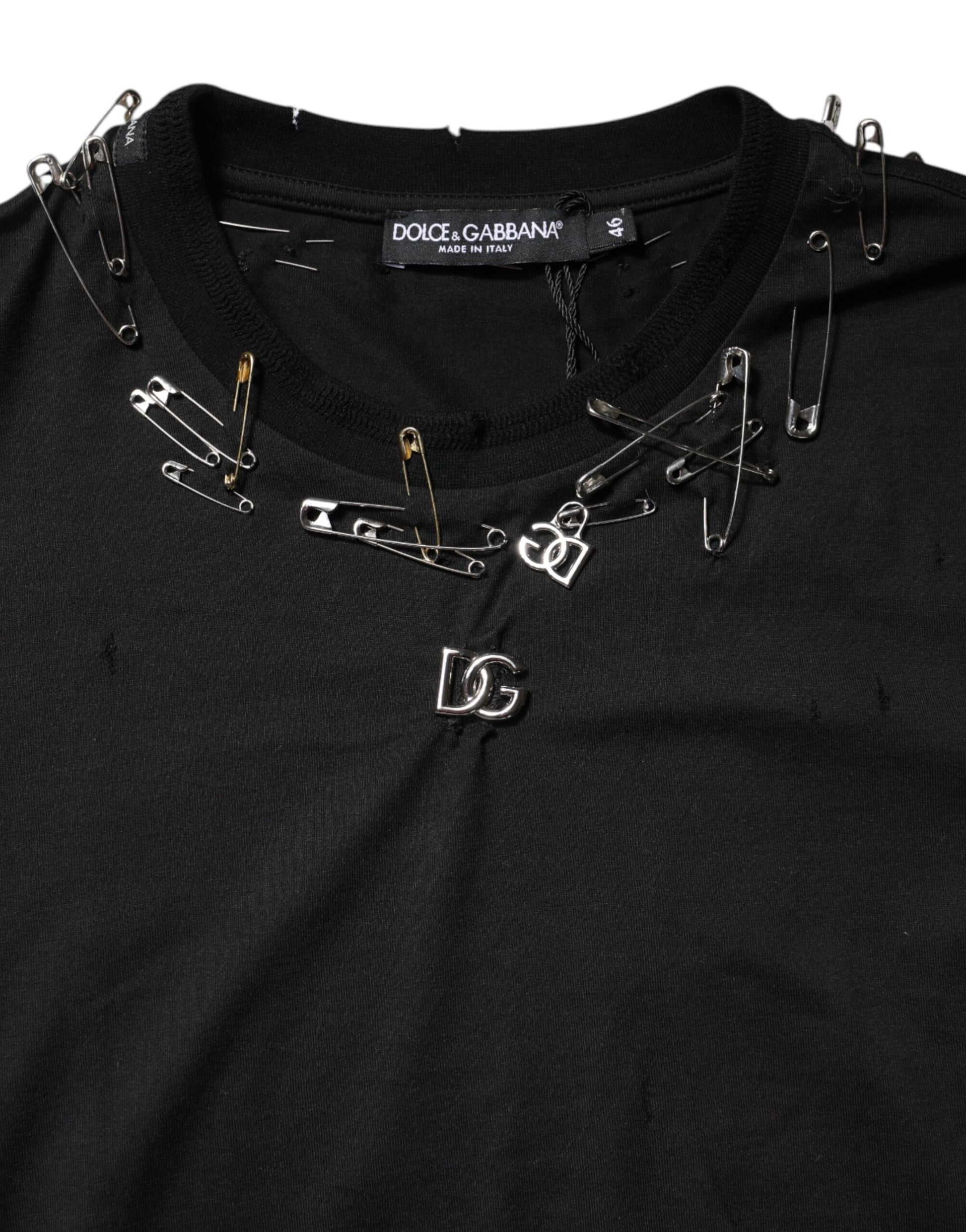 Black shirt with multiple pins and clips attached to it