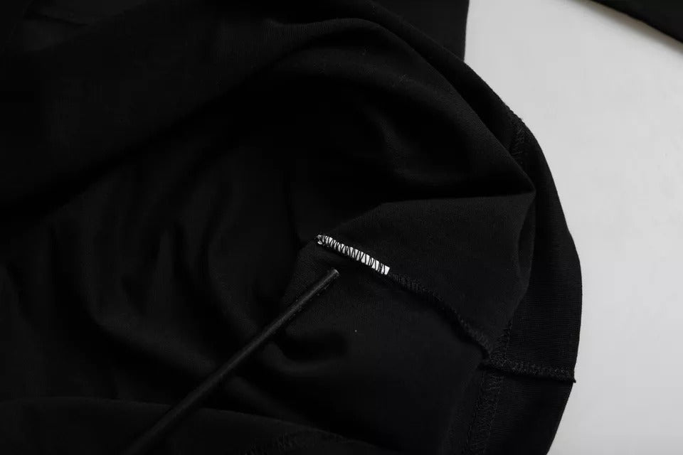Black hoodie on white surface