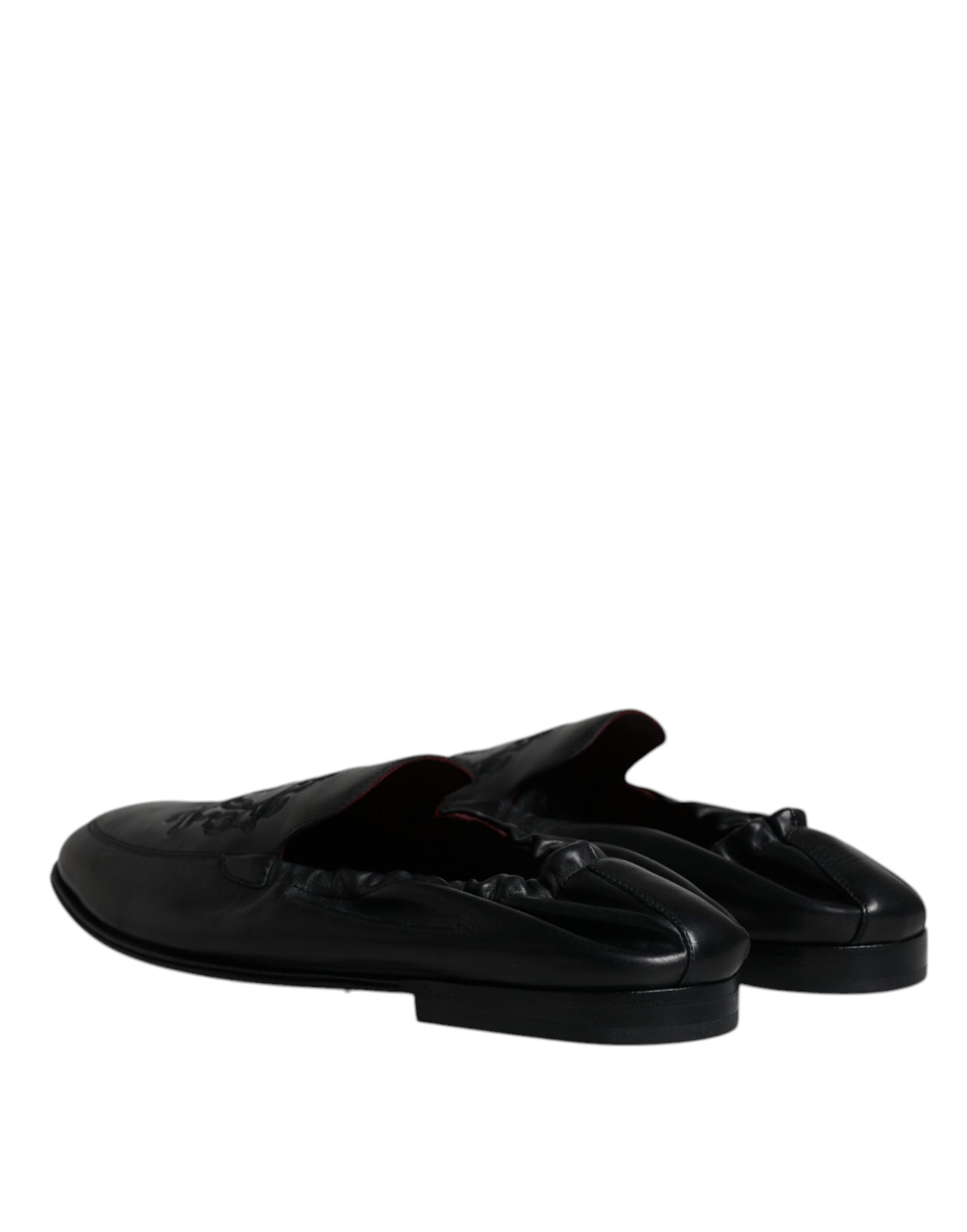 Pair of black shoes with white soles