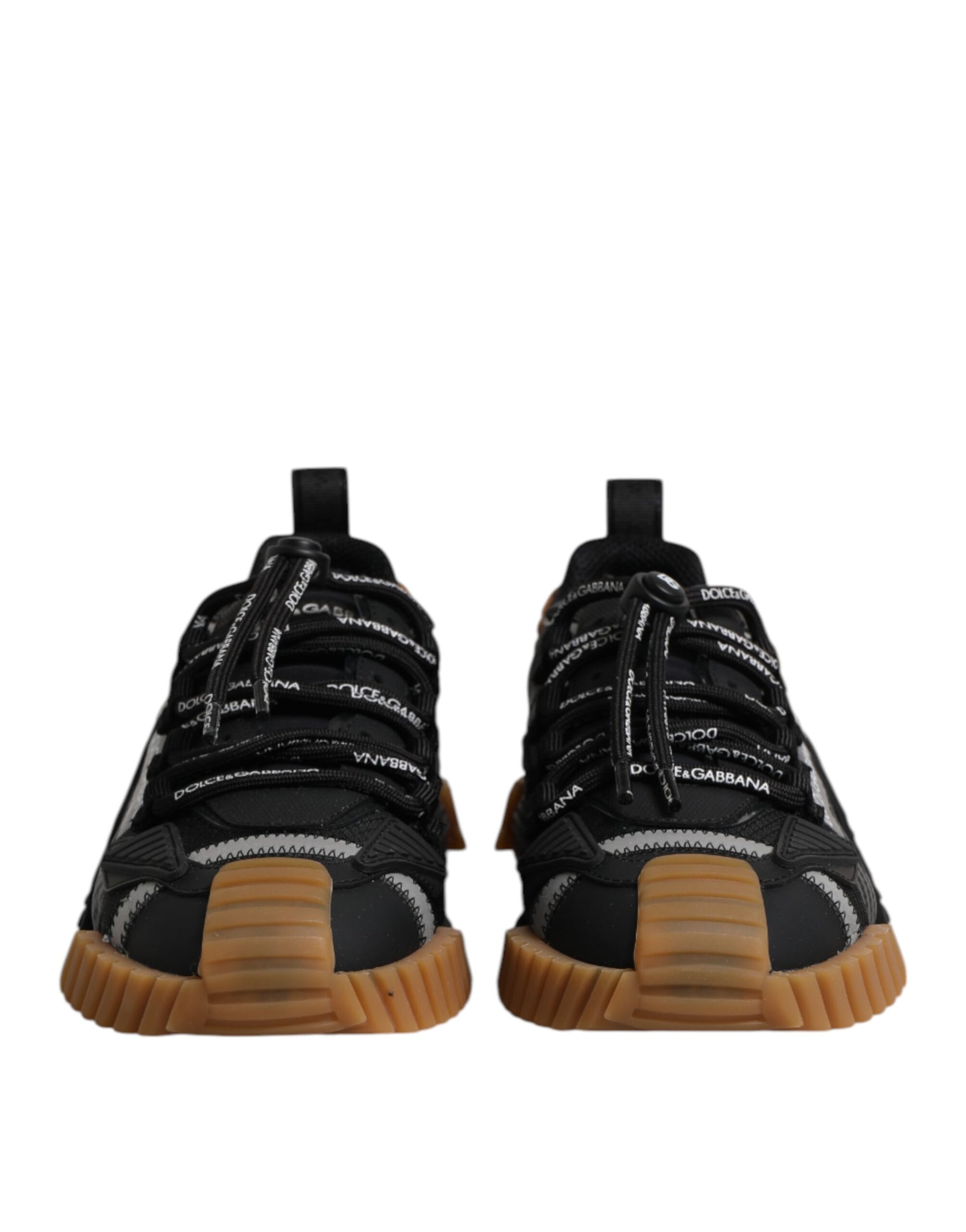 Pair of black lace-up sneakers with white logo and tan soles