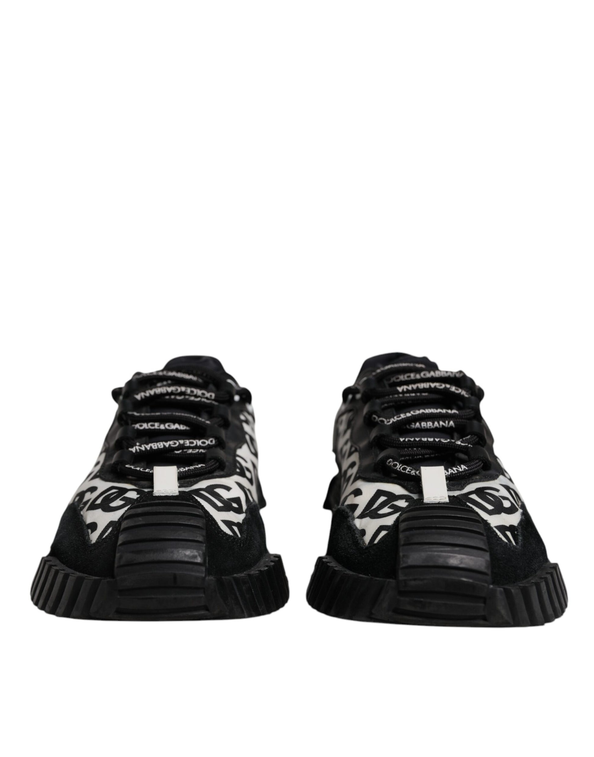 Pair of black sneakers with white laces and a white logo on the side