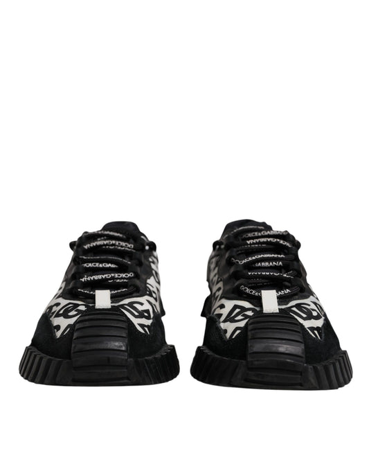 Pair of black sneakers with white laces and a white logo on the side