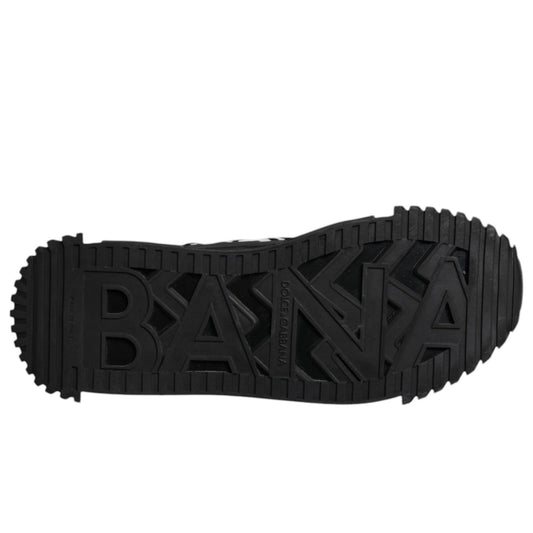 A pair of black lace-up sneakers with a logo on the side