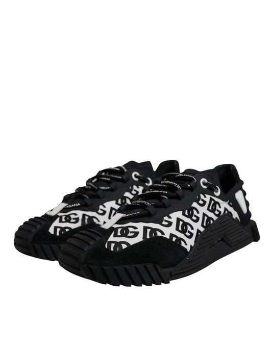 A pair of black lace-up shoes with a logo on the side