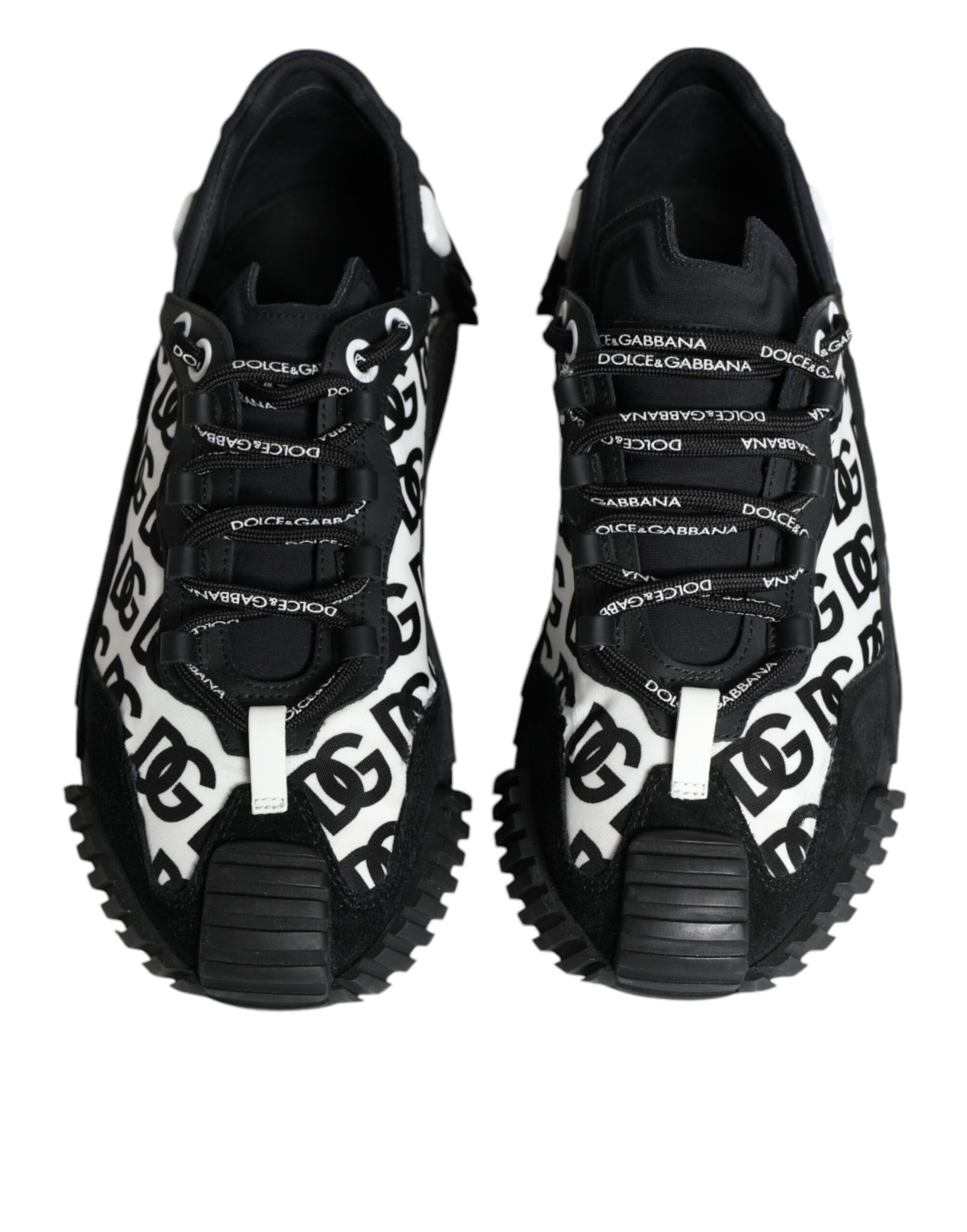Pair of black lace-up sneakers with white logo text and a chunky sole