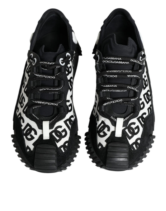 Pair of black lace-up sneakers with white logo text and a chunky sole