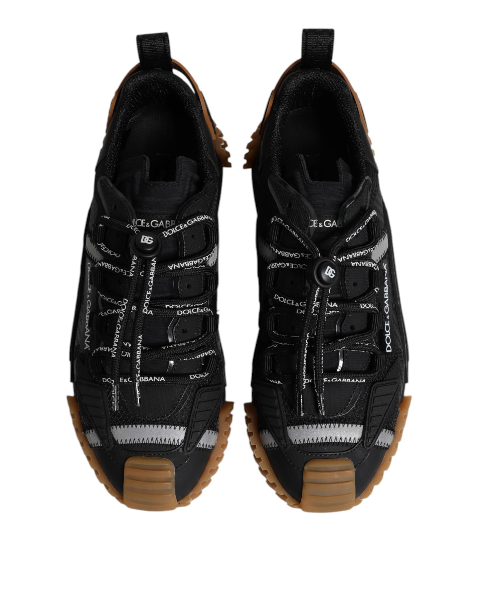 Pair of black lace-up sneakers with white logo and brown sole
