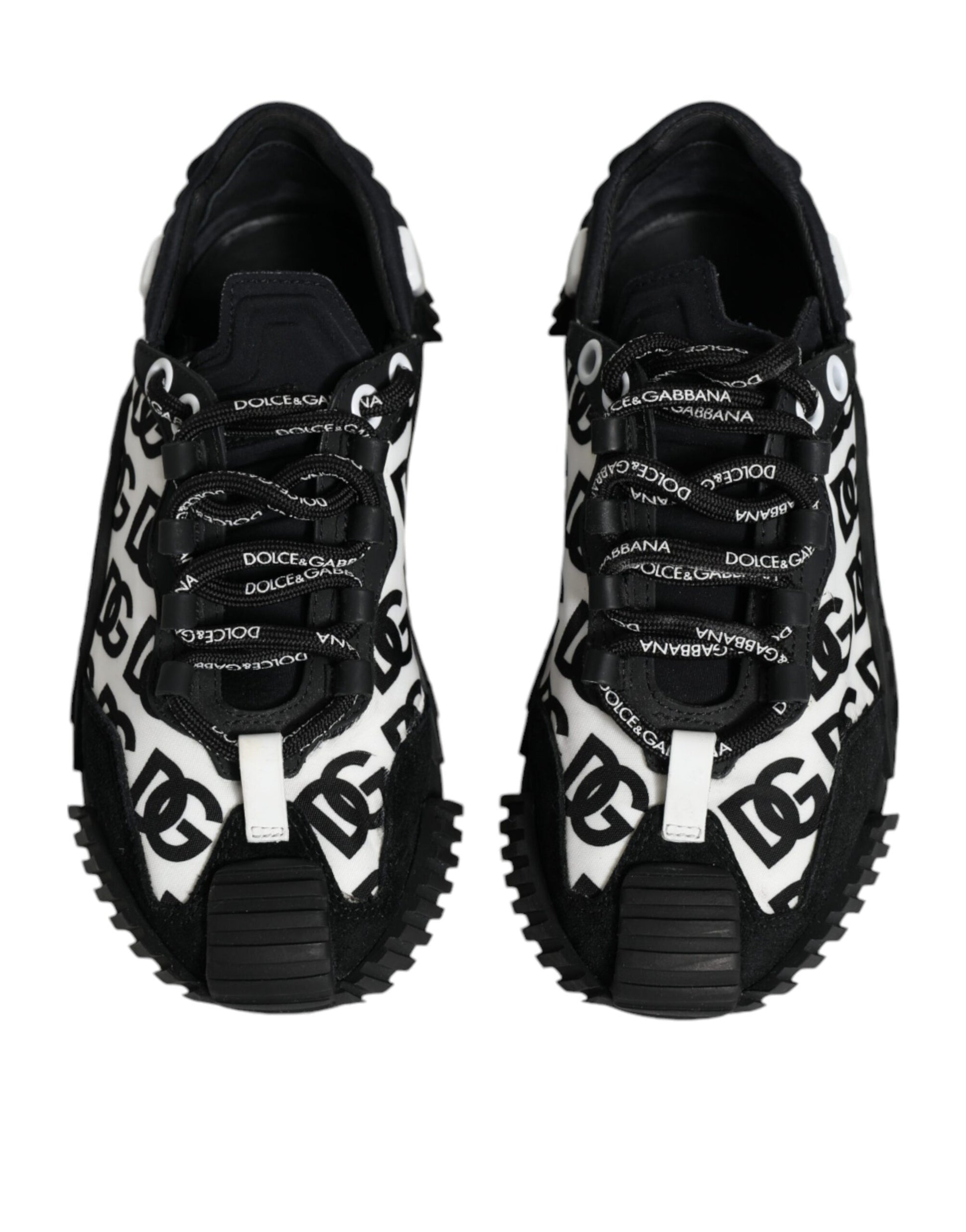 Pair of black lace-up sneakers with white logo print and chunky sole