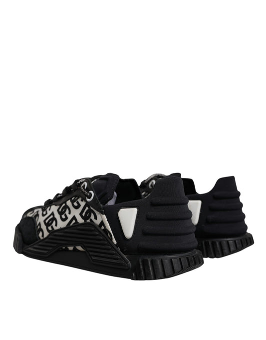Pair of black baby shoes with white trim
