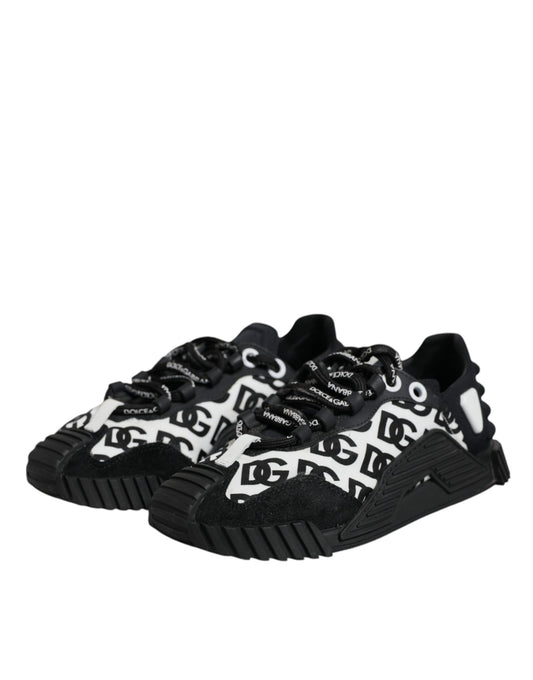 A pair of black lace-up sneakers with white logo print and a chunky sole