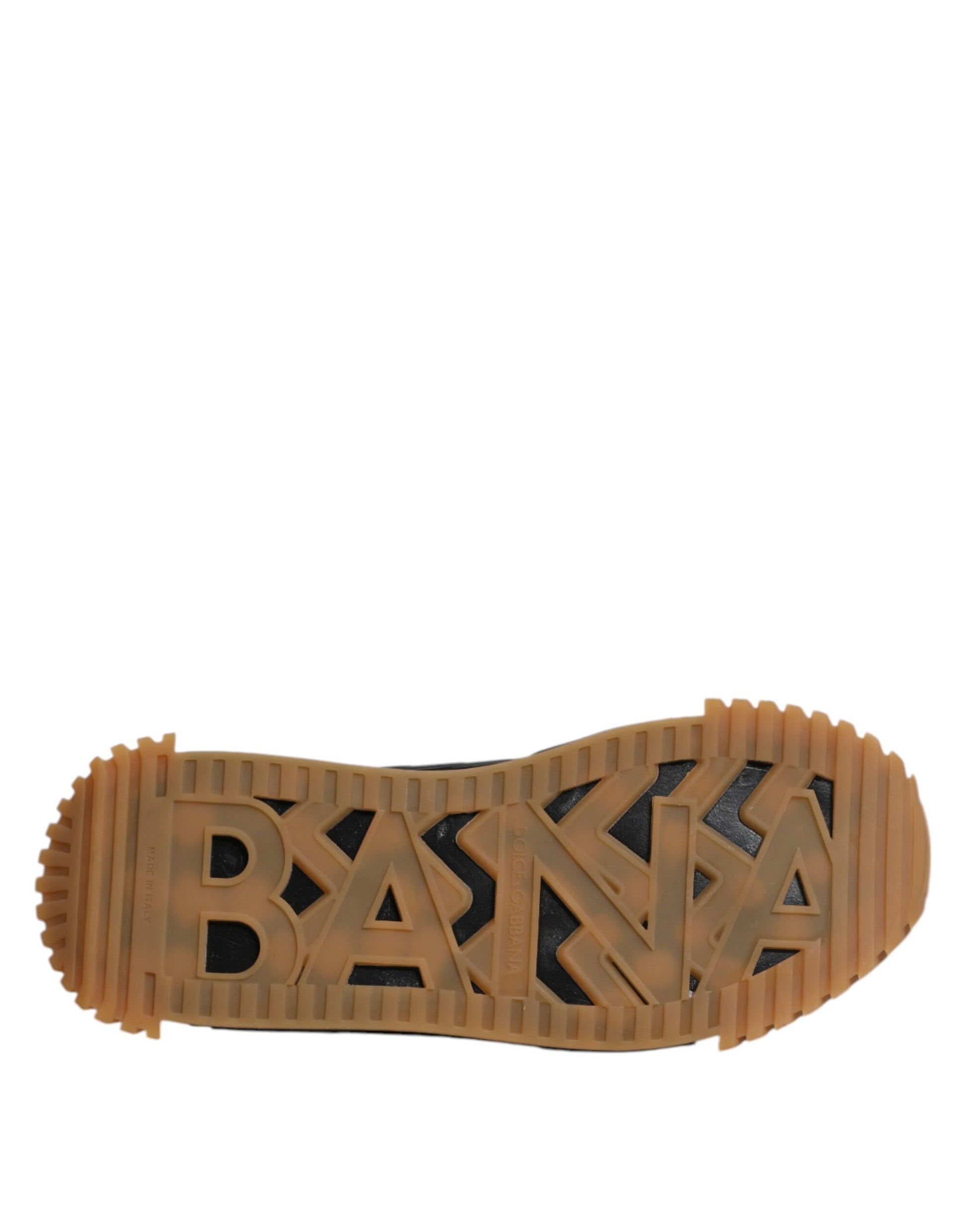 A single black lace-up shoe with a logo on the side, featuring a low top and a flat sole