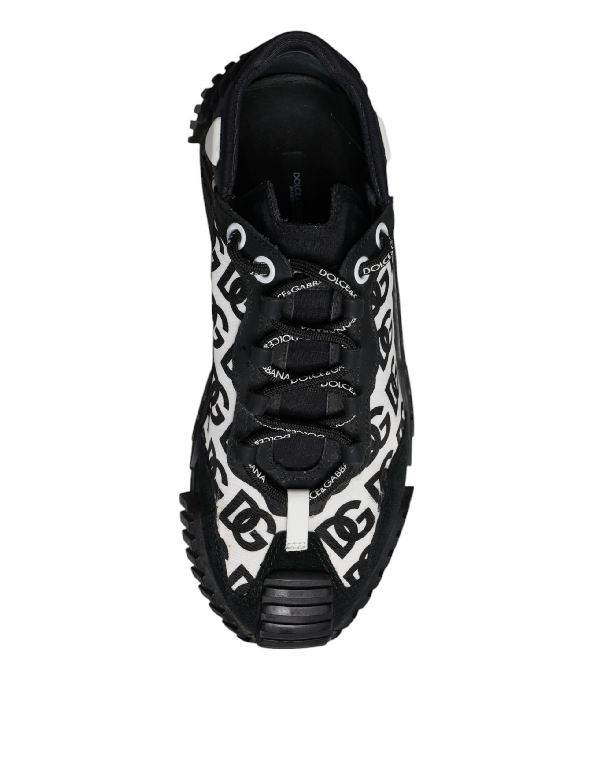 Black sneaker with white laces and patterned design on side