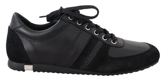 Black leather sneakers with white laces and silver accents
