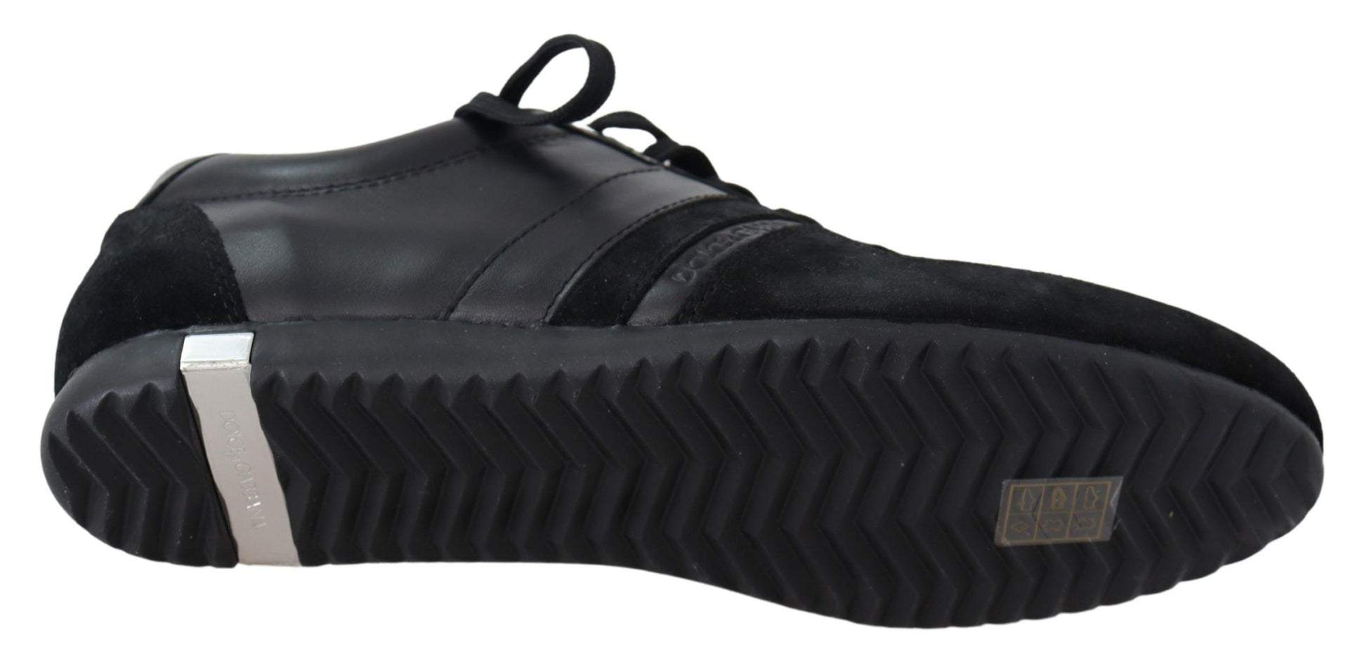 Pair of black sneakers with white laces and a silver logo on the side