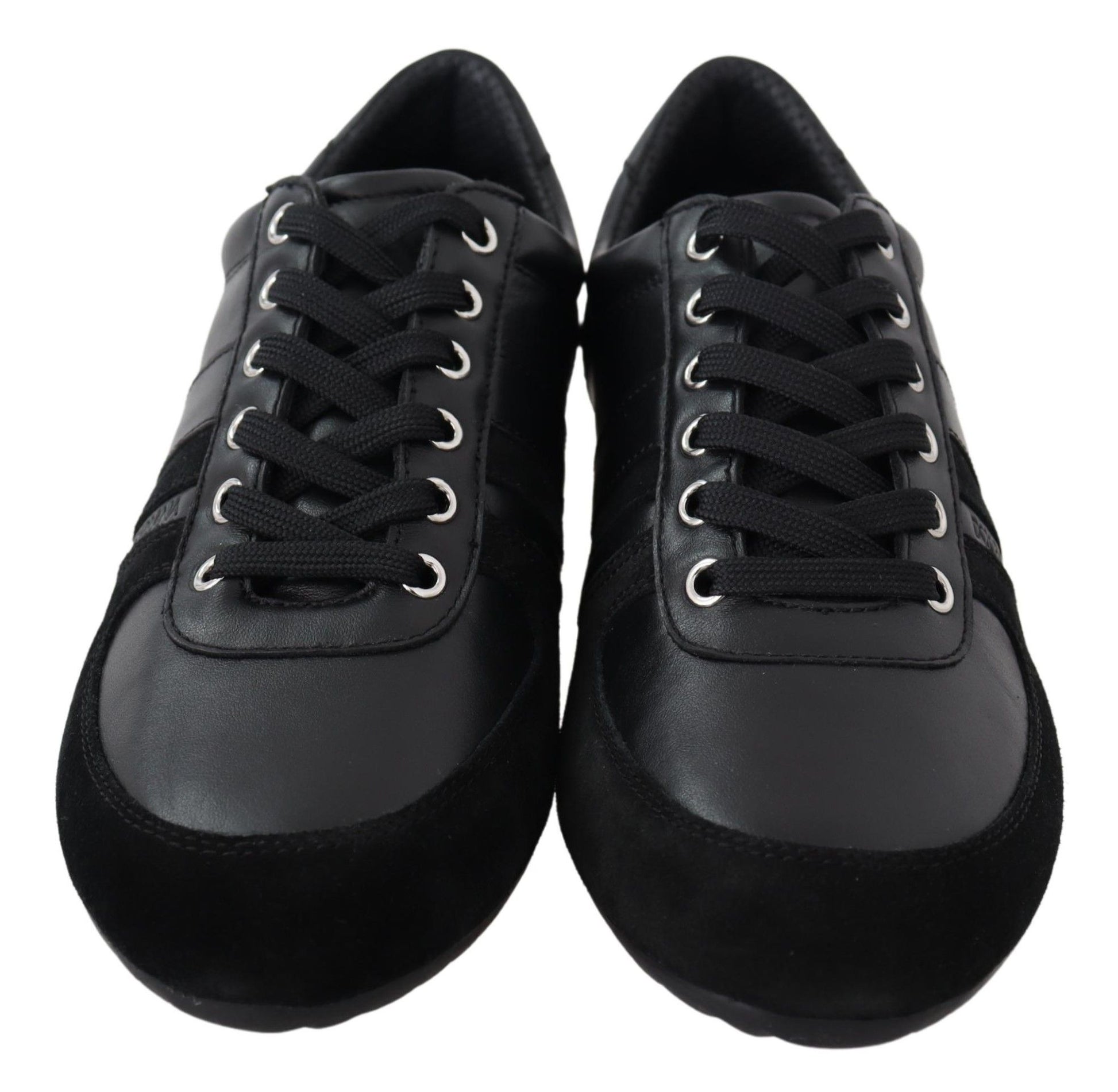 Pair of black sneakers with white laces and a white logo on the side