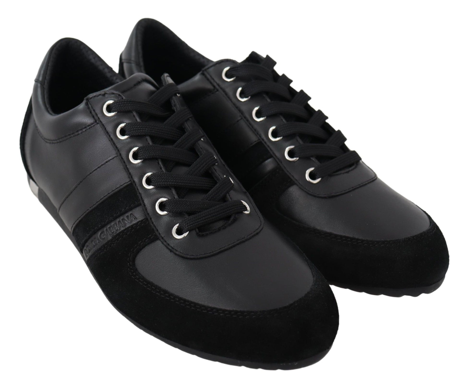 Pair of black shoes with white stripes and laces