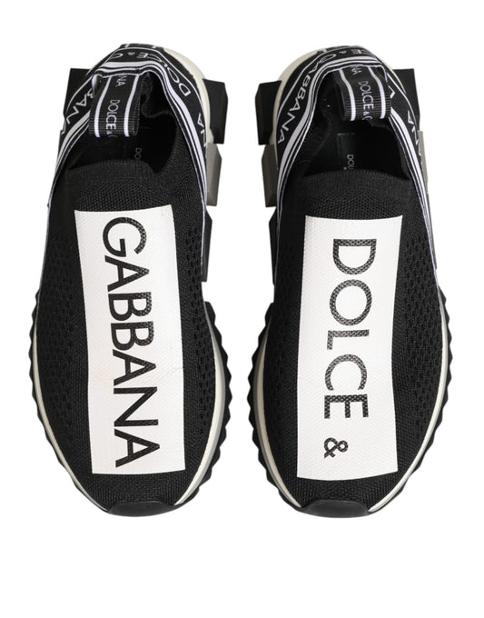 Pair of black sneakers with white brand names on side