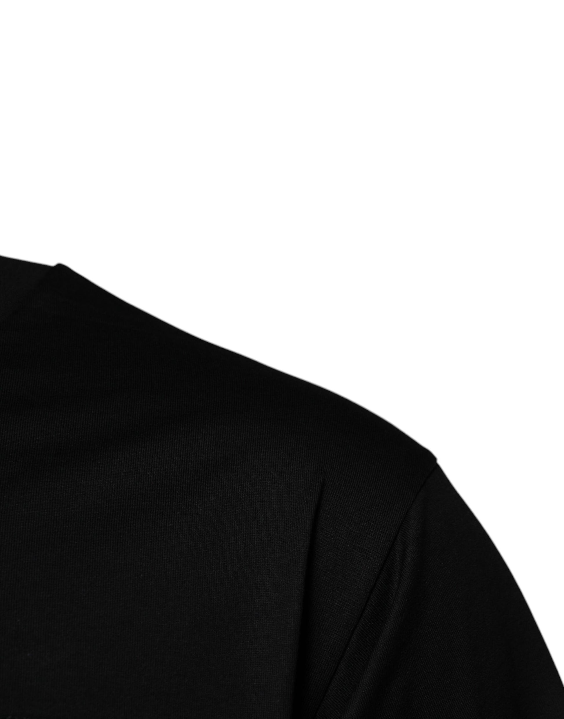 A black garment with a visible texture, possibly a jacket or shirt