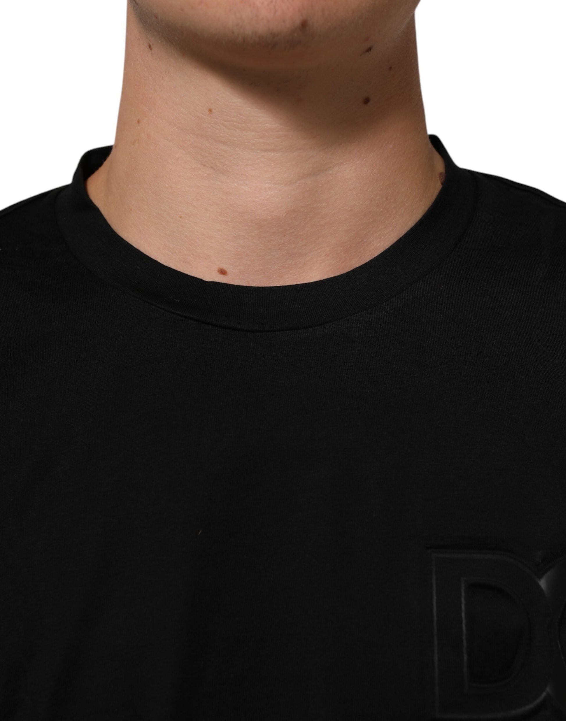 Black crew neck t-shirt with logo patch on chest