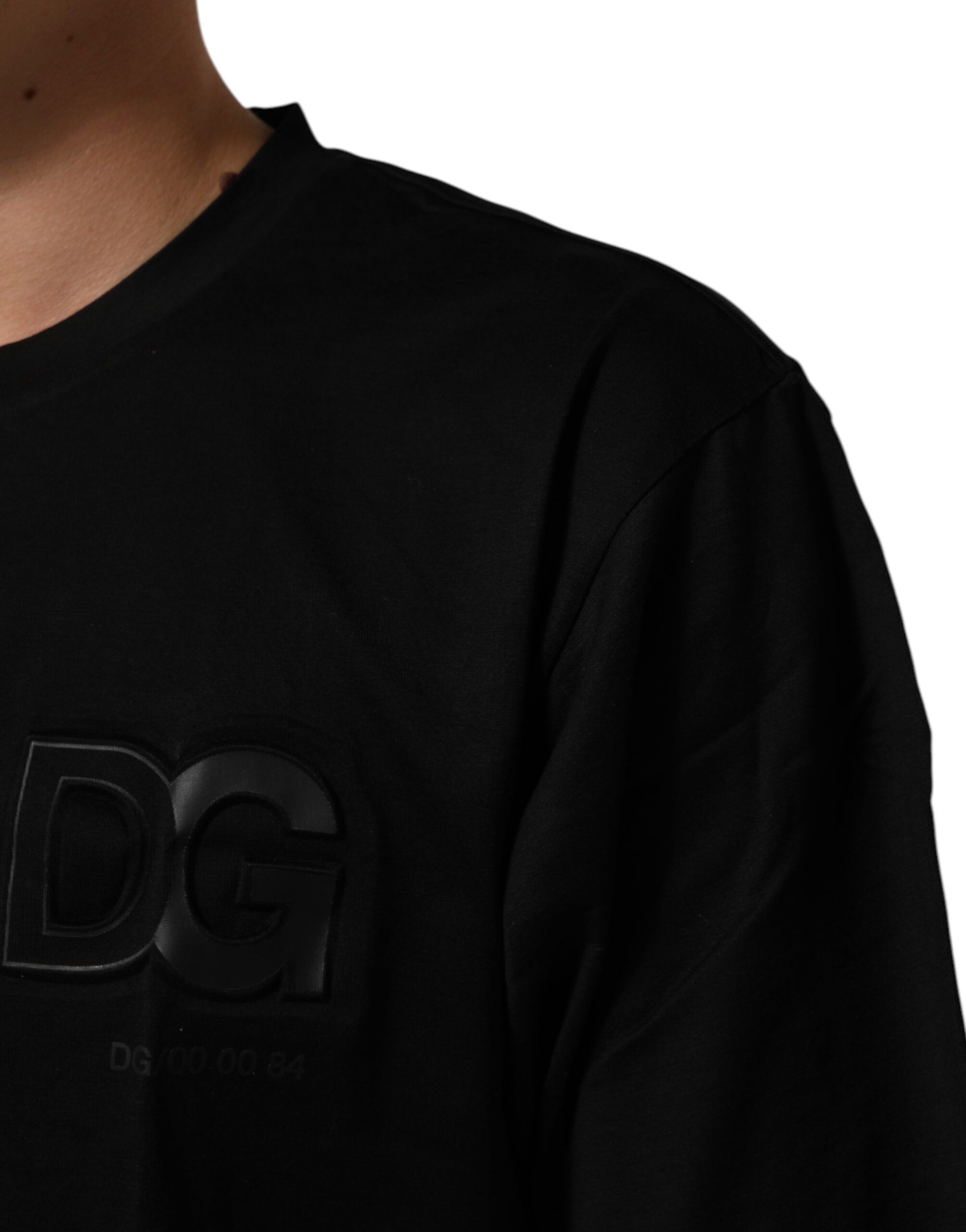 Black crew neck t-shirt with logo patch on left chest