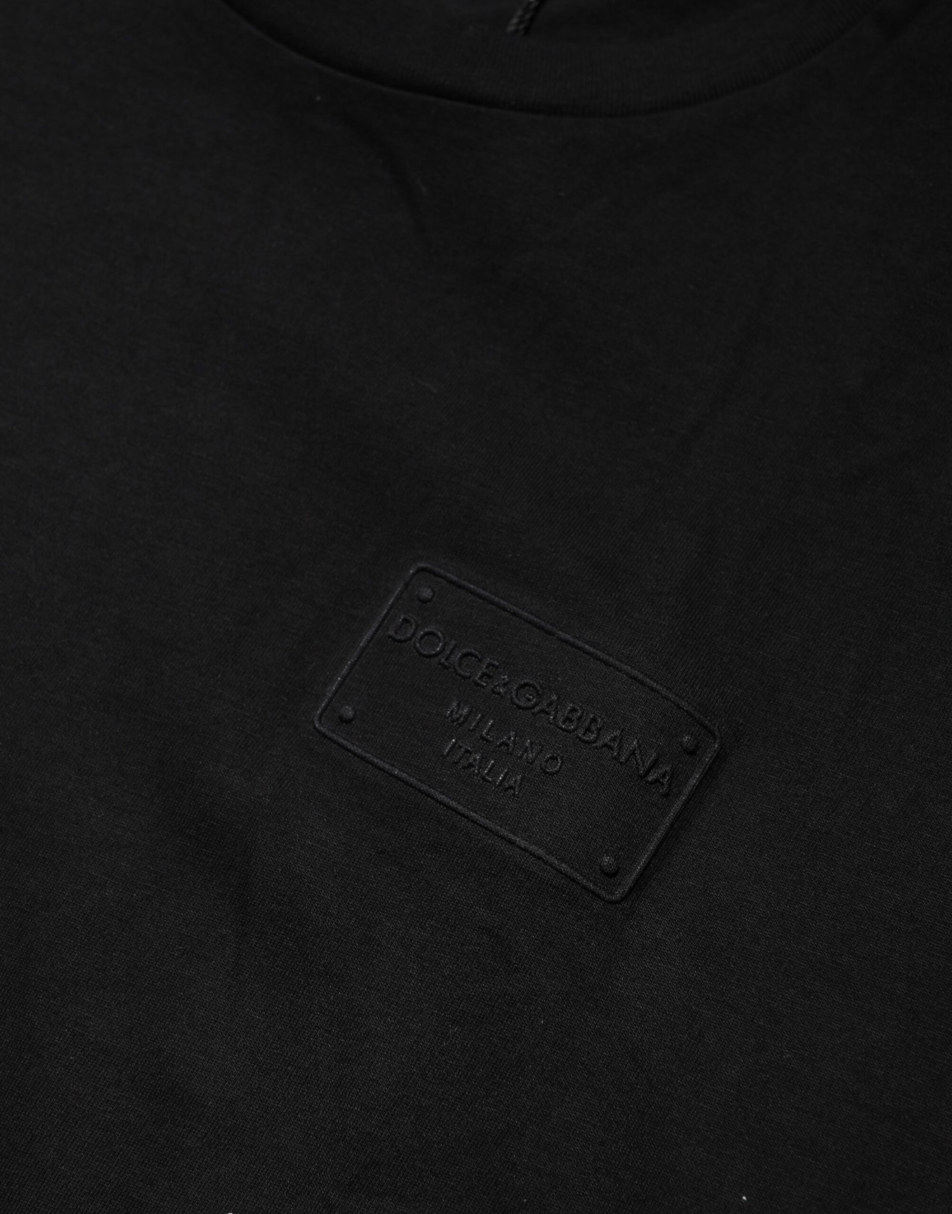 Black t-shirt with a label on the front