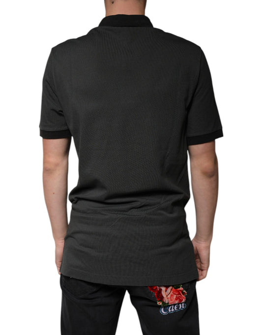 Man wearing dark polo shirt with logo on back