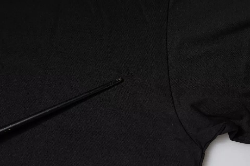 Black long sleeve shirt on hanger