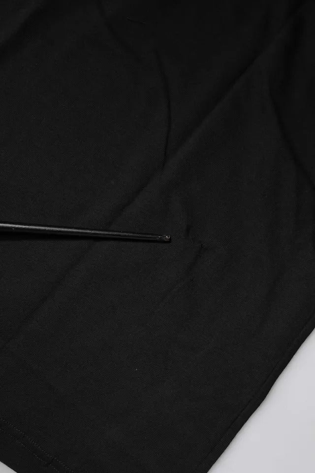 Black fabric with a small black object on top