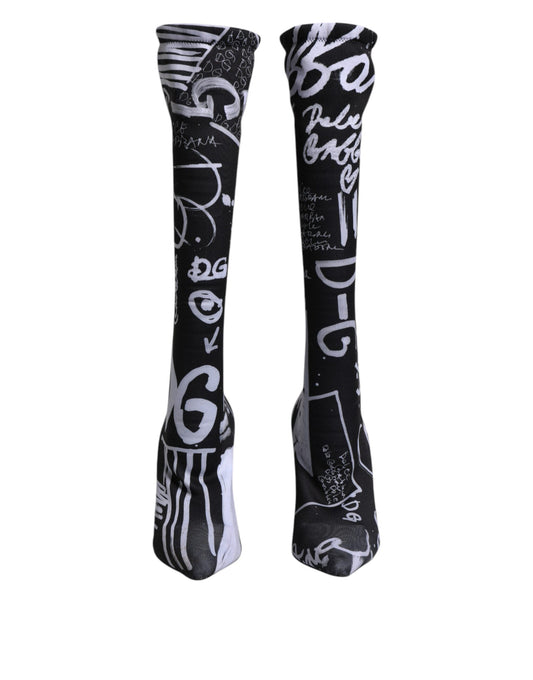 Pair of black socks with white writing